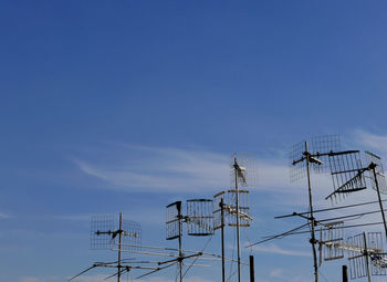 A group of antennas against the clear sky