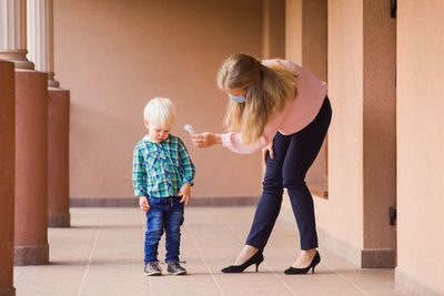 Full length of women standing on floor