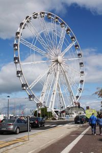 Ferris wheel against sky in city