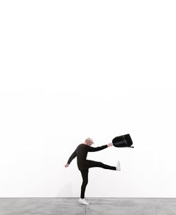 Full length of woman jumping in mid-air