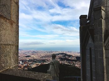 Cityscape against sky seen through window