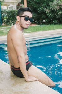 Side view of young man in swimming pool