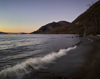 Scenic view of sea against clear sky during sunset