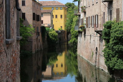 Canal amidst houses and buildings