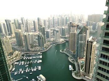 High angle view of buildings in city against sky