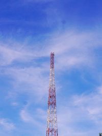 Low angle view of communications tower against sky