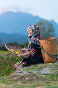 Woman in basket on field