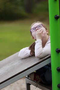 Girl on playground looking away