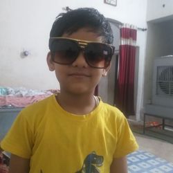 Portrait of boy standing in sunglasses