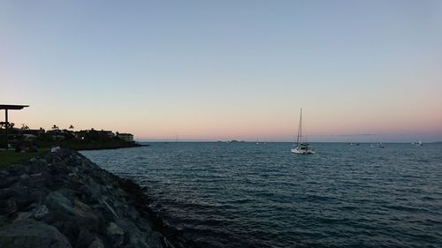 Scenic view of sea against clear sky during sunset