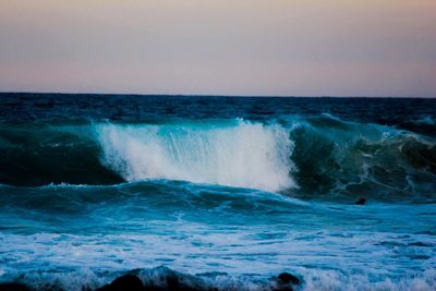 Waves splashing on rocks