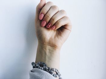 Close-up of cropped hand with nail polish
