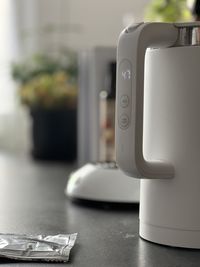 Close-up of smart kettle on table