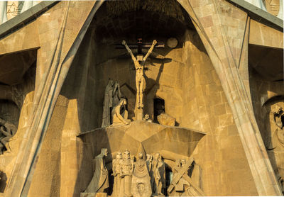 Low angle view of statue against temple