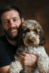 Portrait of young man with dog