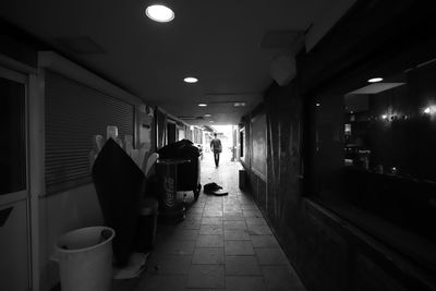 People walking in illuminated building