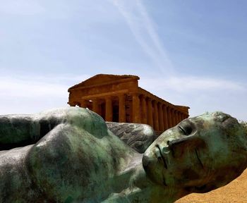 Low angle view of statue against sky