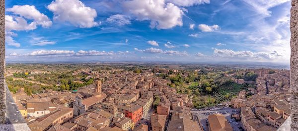 High angle view of townscape against cloudy sky