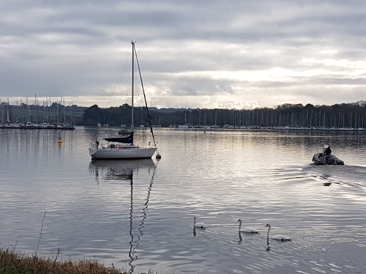 SAILBOAT ON LAKE AGAINST SKY