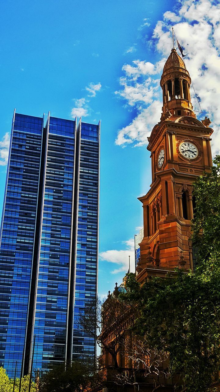 LOW ANGLE VIEW OF BUILDINGS AGAINST CLOUDY SKY