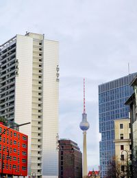 Modern buildings in city against sky