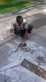 High angle view of man skateboarding on floor