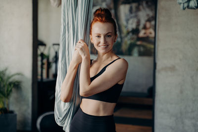 Portrait of smiling woman at home