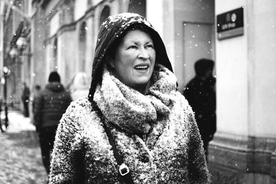 Portrait of smiling woman in snow