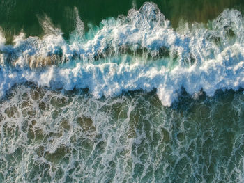 Close-up of water splashing in sea