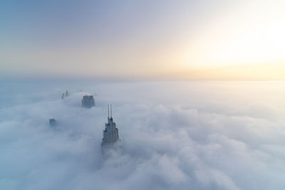 Scenic view of building against sky during sunset