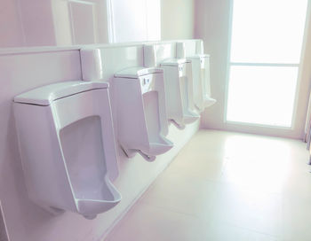 Urinals in public restroom