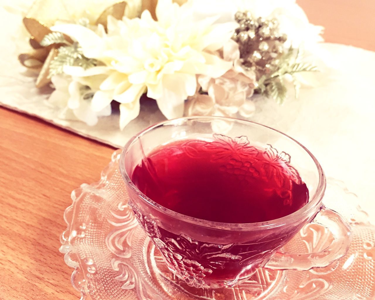 indoors, freshness, table, red, decoration, flower, close-up, still life, food and drink, sweet food, cake, indulgence, dessert, home interior, high angle view, food, no people, celebration, floral pattern, vase