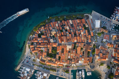 High angle view of buildings and sea in city