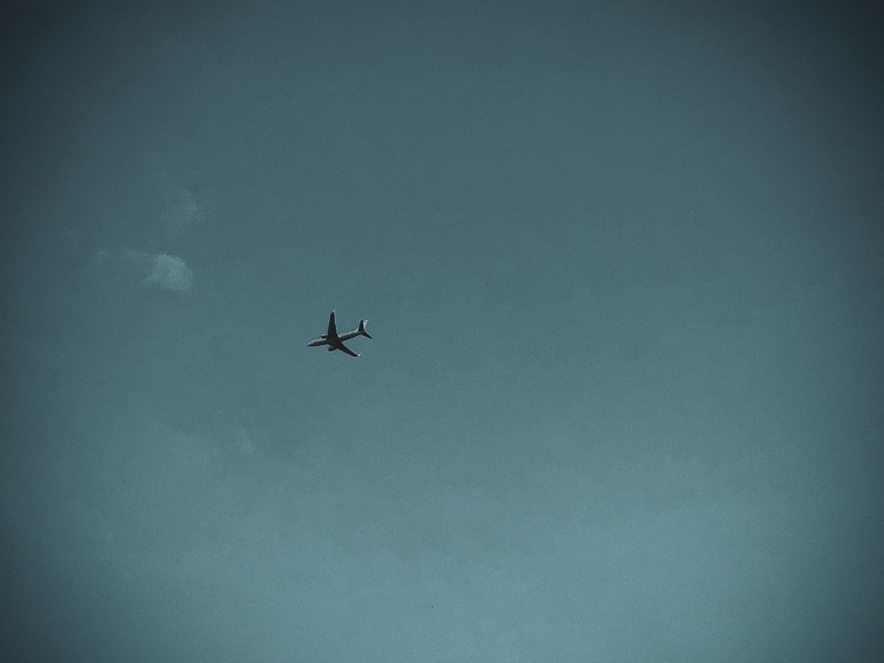 LOW ANGLE VIEW OF AIRPLANE IN SKY