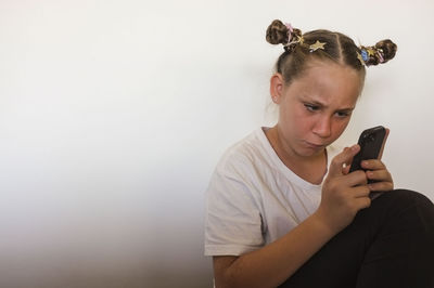 Young woman using mobile phone