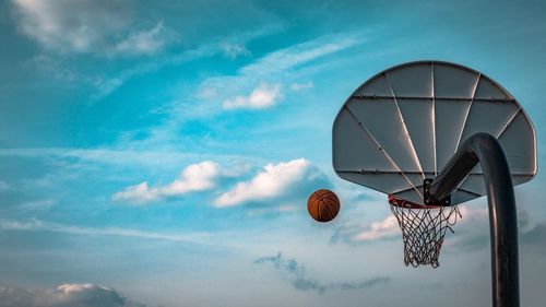 Low angle view of basketball hoop against sky