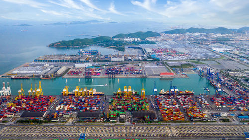 Aerial view commercial sea port warehouse and crane ship, container ship at industrial port