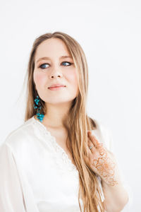 Portrait of a beautiful young woman over white background