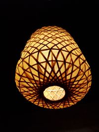 Low angle view of illuminated electric lamp