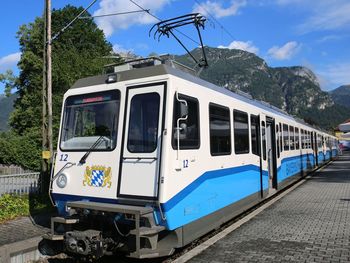 Train on railroad track against sky