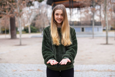 Portrait of smiling young woman in winter