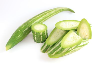 Close-up of green pepper against white background