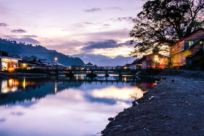 Scenic view of lake against sky at sunset