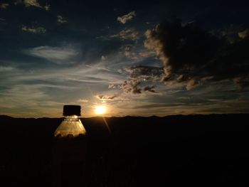 Scenic view of silhouette land against sky during sunset