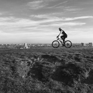 People riding bicycle on road
