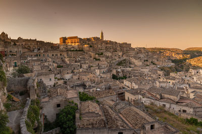 Aerial view of town against sky at sunset