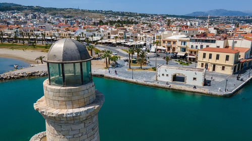 High angle view of townscape by sea