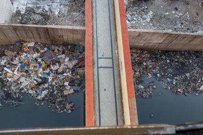 High angle view of garbage on rusty metal