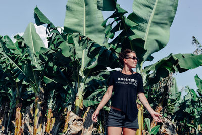 Full length of woman standing on leaves