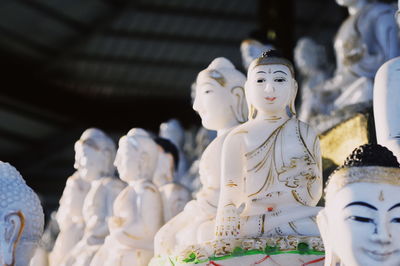 Statue of buddha against building
